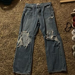 blue ripped jeans are from jbd. and are a size 30 and are made of 100% cotton